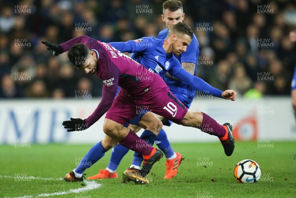 280118 - Cardiff City v Manchester City, Emirates FA Cup Fourth Round - Sergio Aguero of Manchester City is tackled by Joe Bennett of Cardiff City