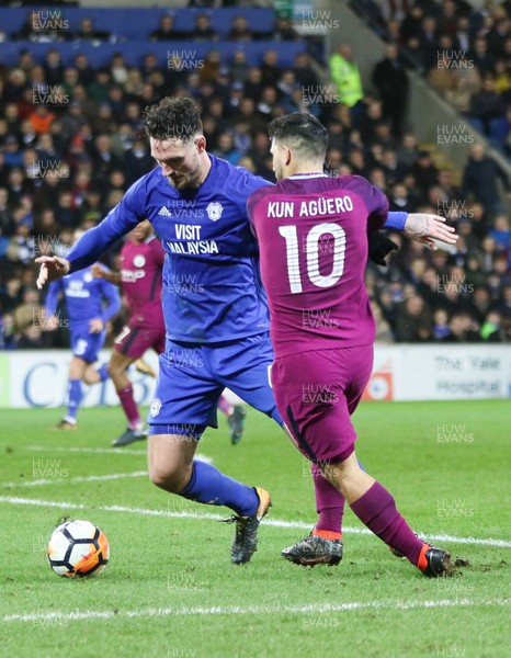 280118 - Cardiff City v Manchester City, Emirates FA Cup Fourth Round - Sergio Aguero of Manchester City takes on Sean Morrison of Cardiff City