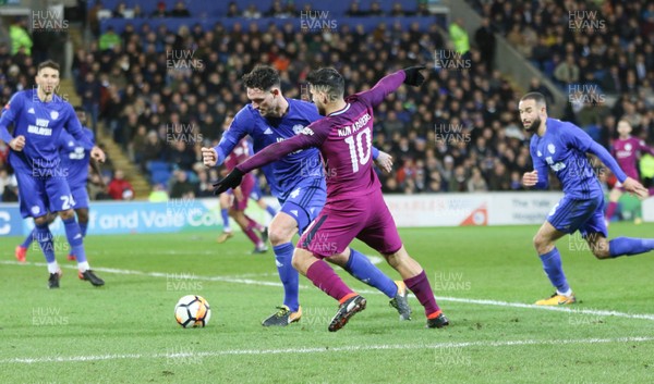 280118 - Cardiff City v Manchester City, Emirates FA Cup Fourth Round - Sergio Aguero of Manchester City takes on Sean Morrison of Cardiff City