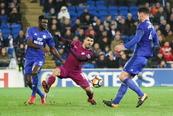 280118 - Cardiff City v Manchester City, Emirates FA Cup Fourth Round - Sergio Aguero of Manchester City competes with Bruno Ecuele Manga of Cardiff City and Sean Morrison of Cardiff City