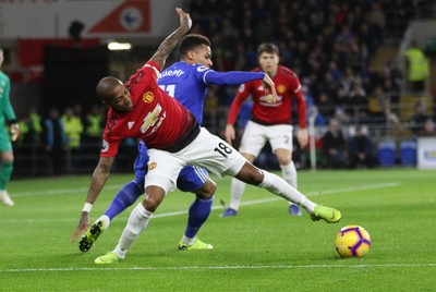 221218 - Cardiff City v Manchester United, Premier League - Ashley Young of Manchester United and Josh Murphy of Cardiff City compete for the ball