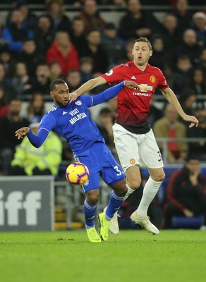 221218 - Cardiff City v Manchester United, Premier League - Junior Hoilett of Cardiff City and Nemanja Matic of Manchester United compete for the ball