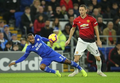 221218 - Cardiff City v Manchester United, Premier League - Junior Hoilett of Cardiff City and Nemanja Matic of Manchester United compete for the ball