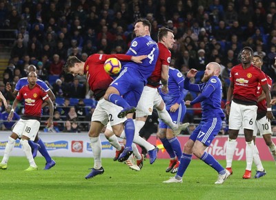 221218 - Cardiff City v Manchester United, Premier League - Sean Morrison of Cardiff City and Victor Lindelof of Manchester United compete for the ball