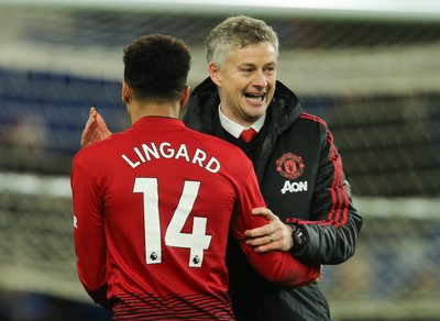 221218 - Cardiff City v Manchester United, Premier League - Manchester United manager Ole Gunnar Solskjaer celebrates with Jesse Lingard of Manchester United at the end of the match