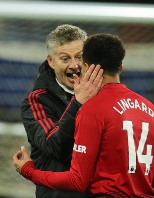 221218 - Cardiff City v Manchester United, Premier League - Manchester United manager Ole Gunnar Solskjaer celebrates with Jesse Lingard of Manchester United at the end of the match