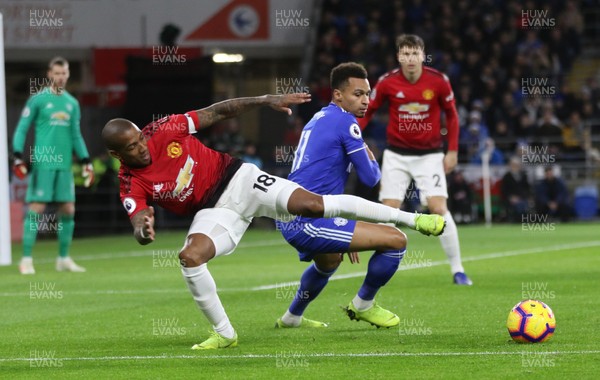 221218 - Cardiff City v Manchester United, Premier League - Ashley Young of Manchester United and Josh Murphy of Cardiff City compete for the ball