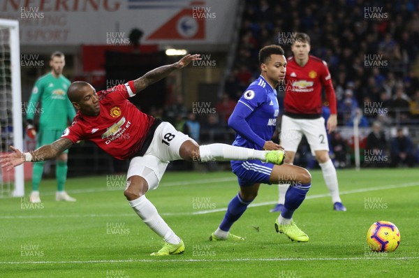 221218 - Cardiff City v Manchester United, Premier League - Ashley Young of Manchester United and Josh Murphy of Cardiff City compete for the ball