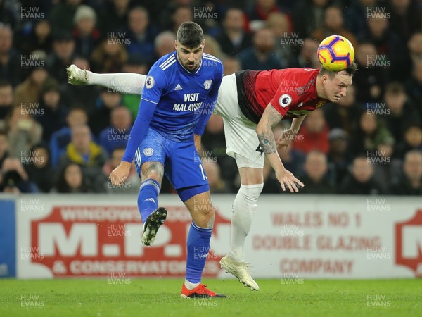221218 - Cardiff City v Manchester United, Premier League - Callum Paterson of Cardiff City and Phil Jones of Manchester United compete for the ball