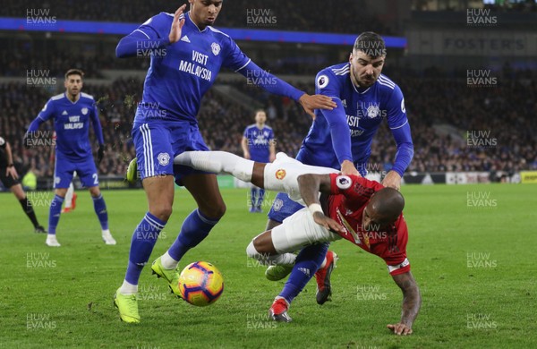 221218 - Cardiff City v Manchester United, Premier League - Ashley Young of Manchester United is challenged for the ball by Josh Murphy of Cardiff City and Callum Paterson of Cardiff City