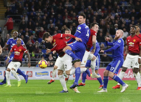 221218 - Cardiff City v Manchester United, Premier League - Sean Morrison of Cardiff City and Victor Lindelof of Manchester United compete for the ball