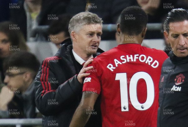 221218 - Cardiff City v Manchester United, Premier League - Manchester United manager Ole Gunnar Solskjaer speaks to Marcus Rashford of Manchester United as he is substituted
