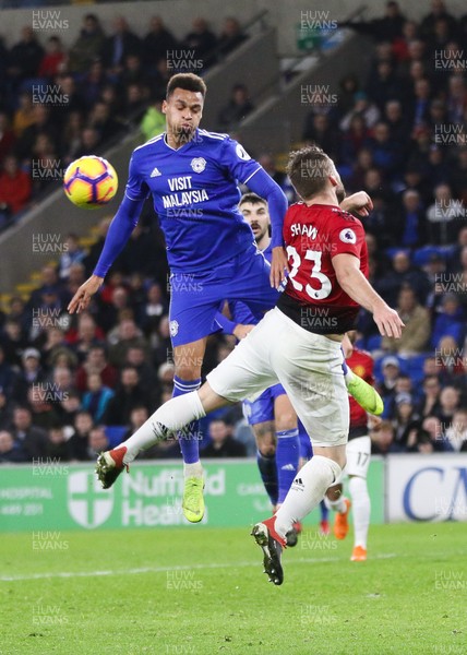 221218 - Cardiff City v Manchester United, Premier League - Josh Murphy of Cardiff City and Luke Shaw of Manchester United compete for the ball