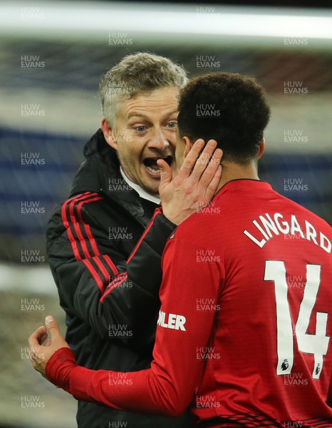 221218 - Cardiff City v Manchester United, Premier League - Manchester United manager Ole Gunnar Solskjaer celebrates with Jesse Lingard of Manchester United at the end of the match