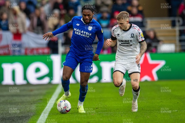 110223 - Cardiff City v Middlesbrough - Sky Bet Championship - Mahlon Romeo of Cardiff City is tackled by Riley McGree of Middlesbrough