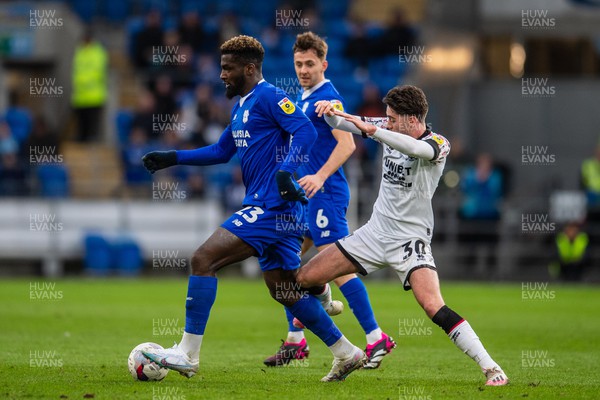 110223 - Cardiff City v Middlesbrough - Sky Bet Championship - Cedric Kipre of Cardiff City is tackled by Hayden Hackney of Middlesbrough