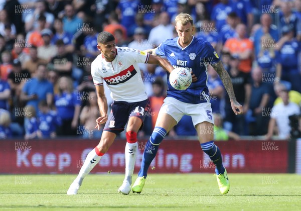 210919 - Cardiff City v Middlesbrough, SkyBet Championship - Aden Flint of Cardiff City and Ashley Fletcher of Middlesbrough compete for the ball