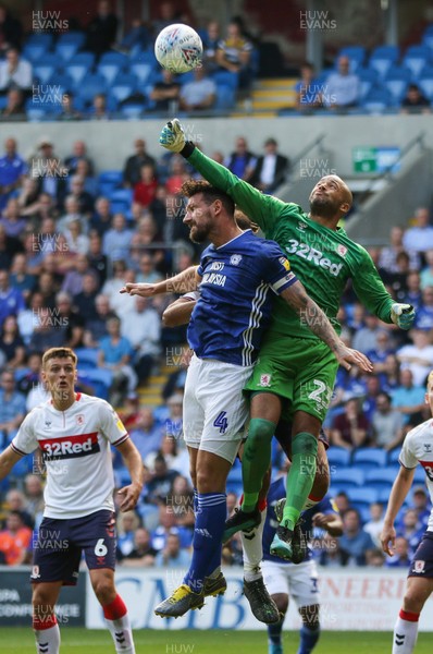 210919 - Cardiff City v Middlesbrough, SkyBet Championship - Sean Morrison of Cardiff City  is beaten to the ball as Middlesbrough goalkeeper Darren Randolph punches clear