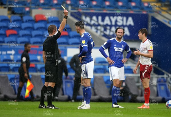 241020 - Cardiff City v Middlesbrough - SkyBet Championship - Kieffer Moore of Cardiff City is given a yellow card by referee John Brooks