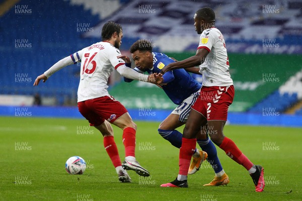 241020 - Cardiff City v Middlesbrough - SkyBet Championship - Josh Murphy of Cardiff City is tackled by Jonathan Howson and Anfernee Dijksteel of Middlesbrough