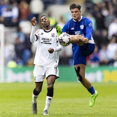 270424 - Cardiff City v Middlesbrough - Sky Bet Championship - Ollie Tanner of Cardiff City in action against Isaiah Jones of Middlesbrough