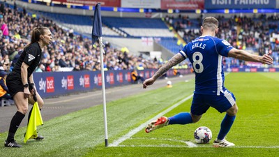 270424 - Cardiff City v Middlesbrough - Sky Bet Championship - Joe Ralls of Cardiff City takes a corner in front of Assistant Referee Natalie Aspinall