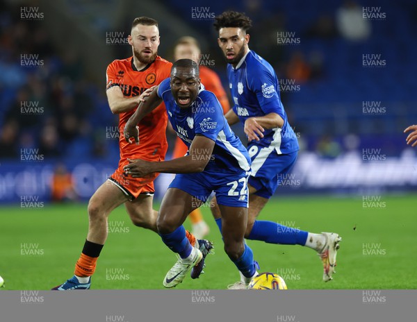 091223  - Cardiff City v Millwall, EFL Sky Bet Championship - Yakou Meite of Cardiff City looks to win the ball as he holds off Allan Campbell of Millwall