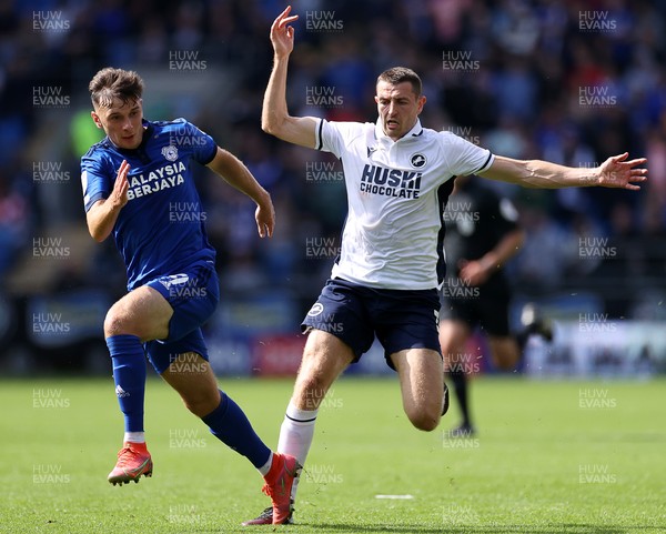 210821 - Cardiff City v Millwall - SkyBet Championship - Mark Harris of Cardiff City is tackled by Murray Wallace of Millwall