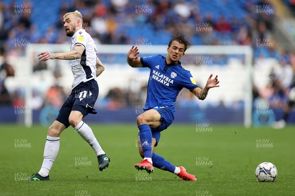210821 - Cardiff City v Millwall - SkyBet Championship - Tom Sang of Cardiff City is challenged by Scott Malone of Millwall