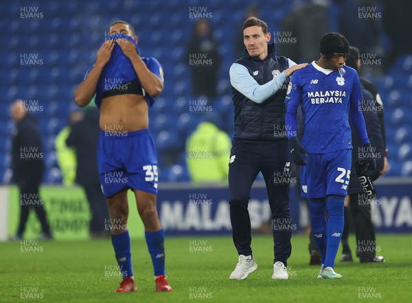 210123 - Cardiff City v Millwall, EFL Sky Bet Championship - Cardiff City caretaker manager Dean Whitehead with Andy Rinomhota of Cardiff City and Jaden Philogene of Cardiff City at the end of the match