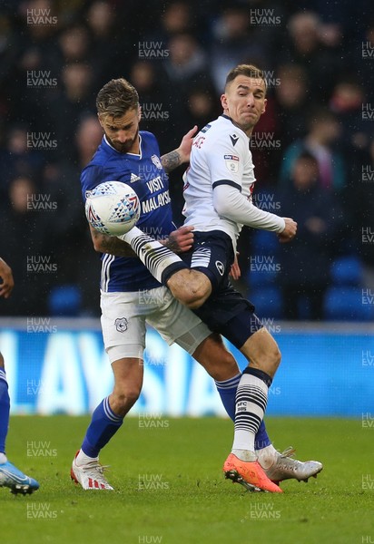 261219 - Cardiff City v Millwall, Sky Bet Championship - Joe Bennett of Cardiff City and Jed Wallace of Millwall compete for the ball