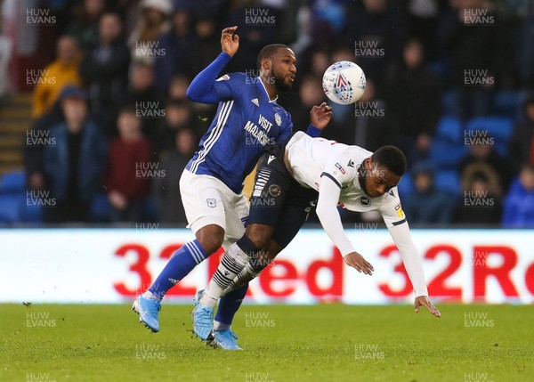 261219 - Cardiff City v Millwall, Sky Bet Championship - Junior Hoilett of Cardiff City and Mahlon Romeo of Millwall compete for the ball