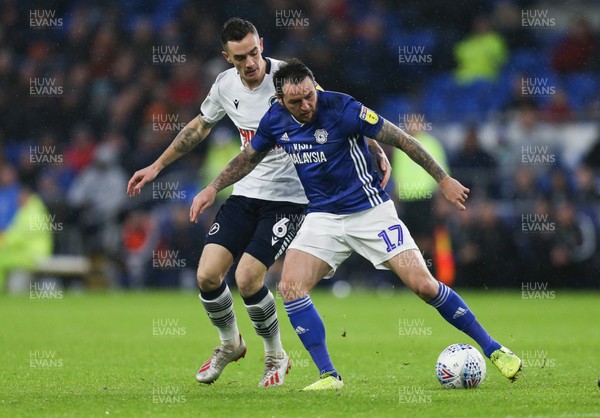261219 - Cardiff City v Millwall, Sky Bet Championship - Lee Tomlin of Cardiff City holds off the challenge from Shaun Williams of Millwall