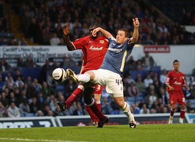 26.08.08...Cardiff City v MK Dons, Carling Cup Round 2 -  Cardiff's Ross McCormack and M K Dons Jude Stirling battle for the ball 