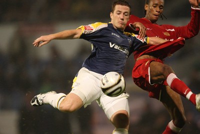 26.08.08...Cardiff City v MK Dons, Carling Cup Round 2 -  Cardiff's Ross McCormack fires shot at goal as M K Dons Shaun Cummings challenges 