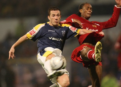 26.08.08...Cardiff City v MK Dons, Carling Cup Round 2 -  Cardiff's Ross McCormack fires shot at goal as M K Dons Shaun Cummings challenges 