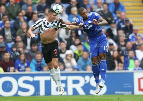 180818 - Cardiff City v Newcastle United, Premier League - Ciaran Clark of Newcastle United beats Kenneth Zohore of Cardiff City to ahed the ball