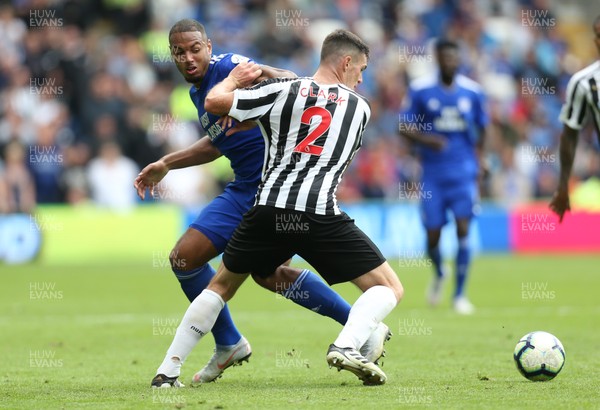 180818 - Cardiff City v Newcastle United, Premier League - Kenneth Zohore of Cardiff City and Ciaran Clark of Newcastle United compete for the ball