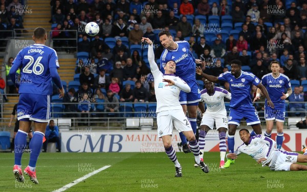 280417 - Cardiff City v Newcastle United, Sky Bet Championship - Sean Morrison of Cardiff City gets above Ciaran Clark of Newcastle United to head at goal