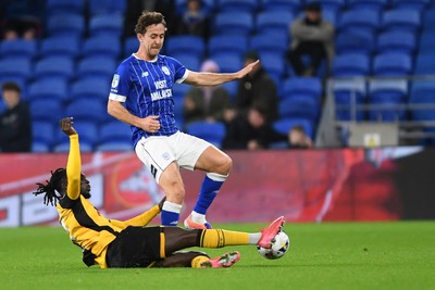 071025 - Cardiff City v Newport County - Vertu Trophy Group Stage - Ryan Wintle of Cardiff City is challenged by Cameron Antwi of Newport County