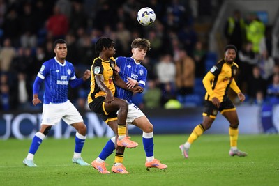 071025 - Cardiff City v Newport County - Vertu Trophy Group Stage - Habeeb Ogunneye of Newport County is challenged by Rob Tankiewicz of Cardiff City