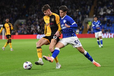 071025 - Cardiff City v Newport County - Vertu Trophy Group Stage - Joe Thomas of Newport County is challenged by Rob Tankiewicz of Cardiff City