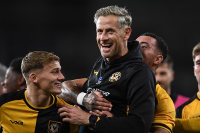 071025 - Cardiff City v Newport County - Vertu Trophy Group Stage - Newport County Manager, David Hughes celebrates the win with his team at full time
