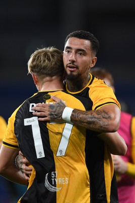 071025 - Cardiff City v Newport County - Vertu Trophy Group Stage - Courtney Baker-Richardson of Newport County celebrates with Tom Davies of Newport County at full time