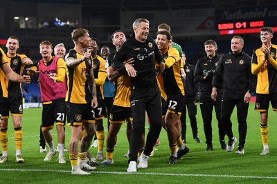 071025 - Cardiff City v Newport County - Vertu Trophy Group Stage - Newport County Manager, David Hughes is pushed towards the Newport supporters to celebrate the win