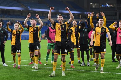 071025 - Cardiff City v Newport County - Vertu Trophy Group Stage - Newport players celebrate with their fans at full time