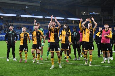 071025 - Cardiff City v Newport County - Vertu Trophy Group Stage - Newport players celebrate with their fans at full time