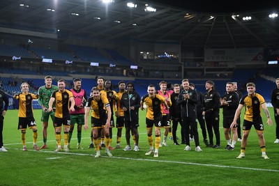 071025 - Cardiff City v Newport County - Vertu Trophy Group Stage - Newport players celebrate with their fans at full time