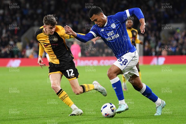 071025 - Cardiff City v Newport County - Vertu Trophy Group Stage - Joe Thomas of Newport County is challenged by T-Jay Parfitt of Cardiff City