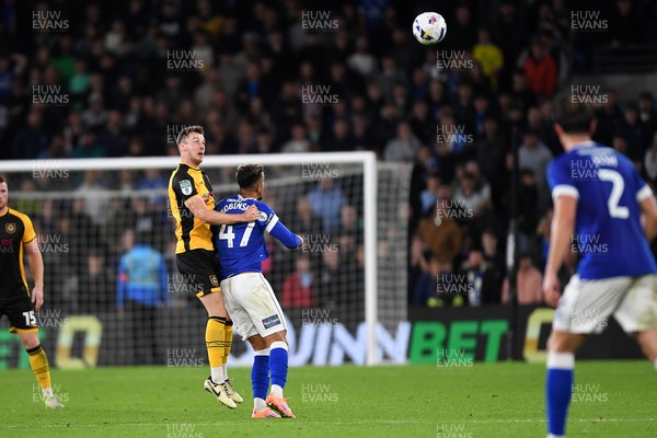 071025 - Cardiff City v Newport County - Vertu Trophy Group Stage - Ciaran Brennan of Newport County is challenged by Callum Robinson of Cardiff City